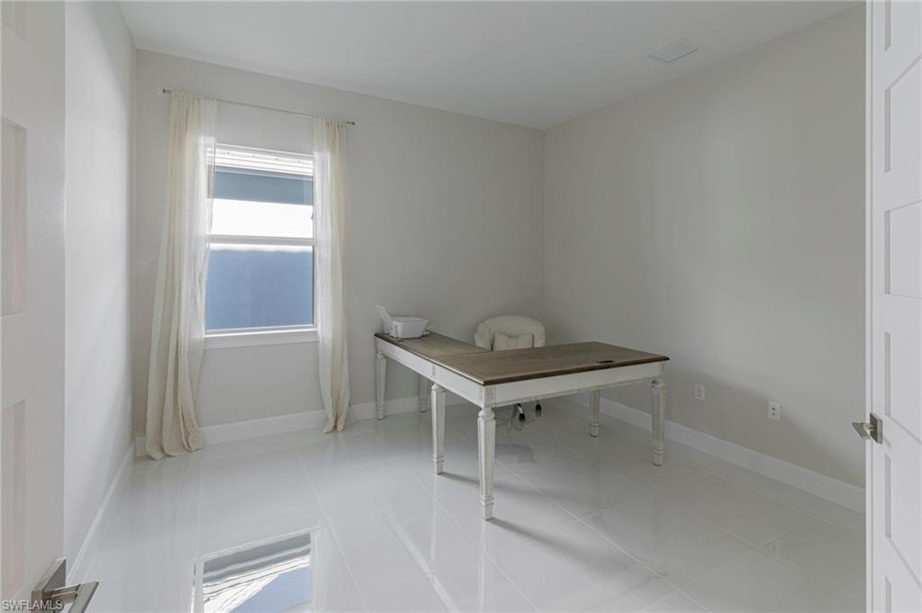 Unfurnished office with light tile patterned floors