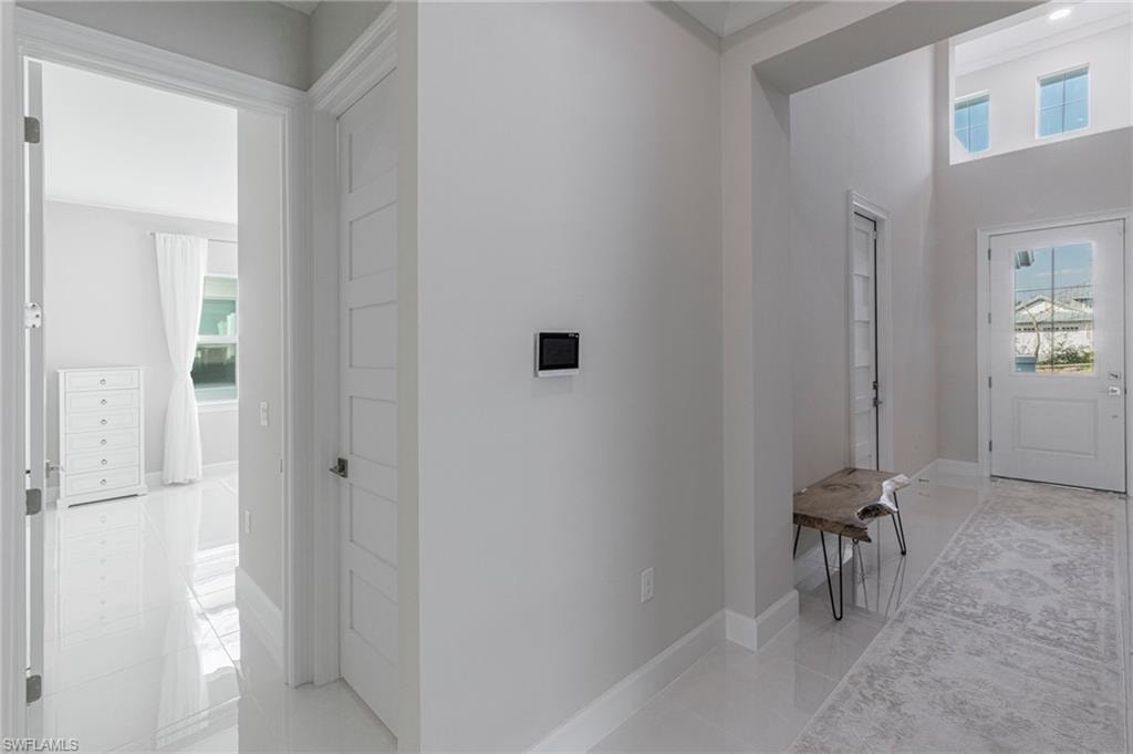 Entrance foyer featuring light tile patterned floors
