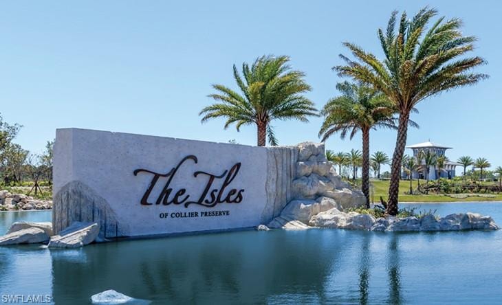 Community sign with a water view