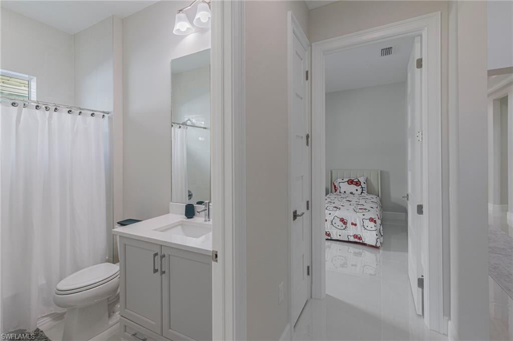 Bathroom with vanity and toilet