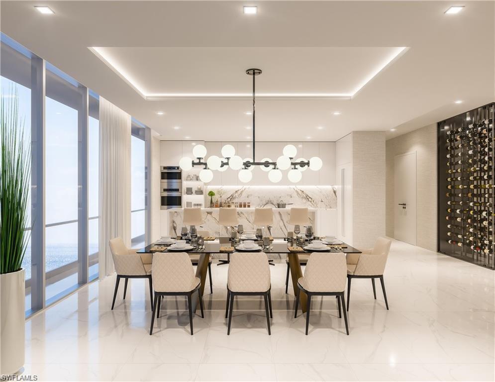 Dining space featuring floor to ceiling windows and recessed lighting