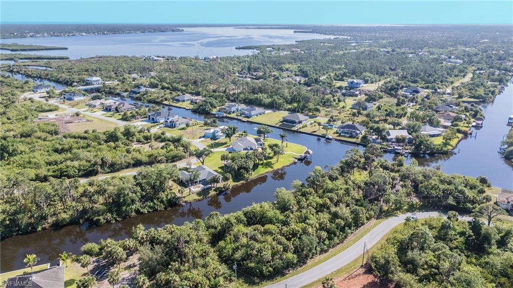 Aerial view of property's location featuring a nearby body of water