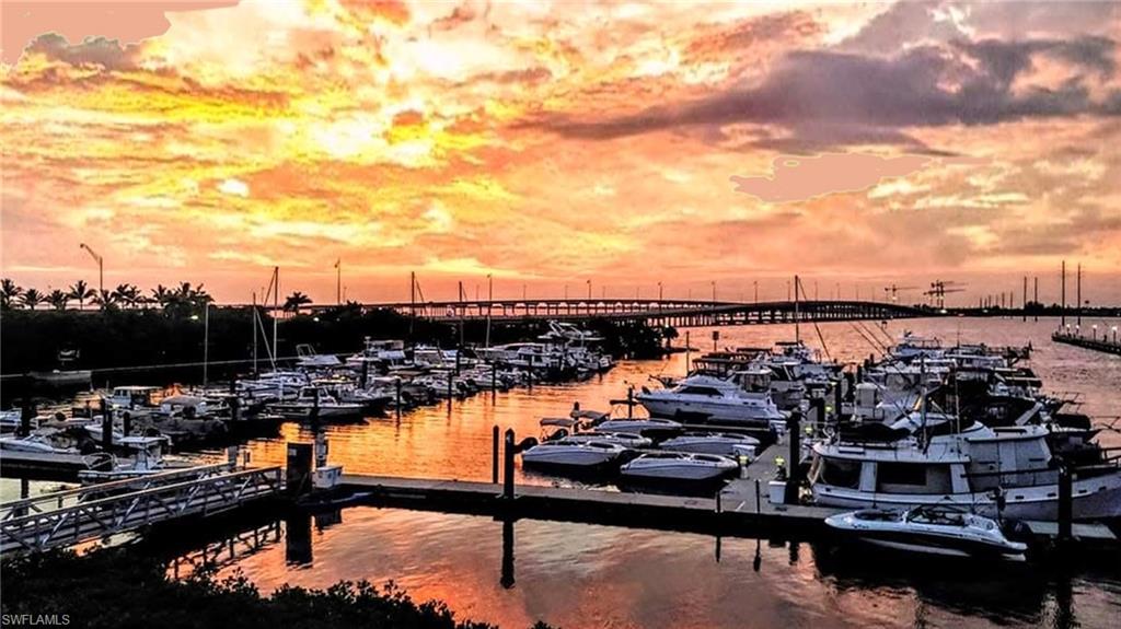 Dock area featuring a water view and view of marina