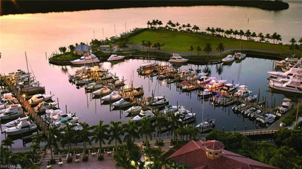 Aerial view of a nearby body of water and numerous boat docks