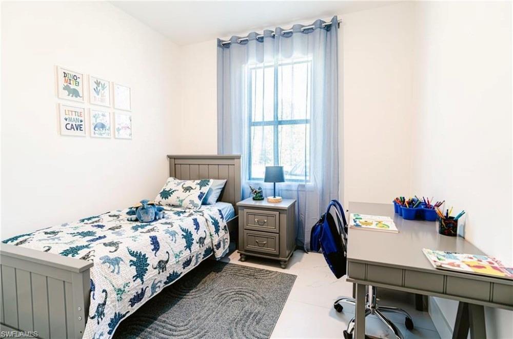 Bedroom featuring an office area