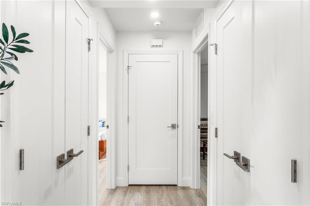 Hallway with light wood finished floors