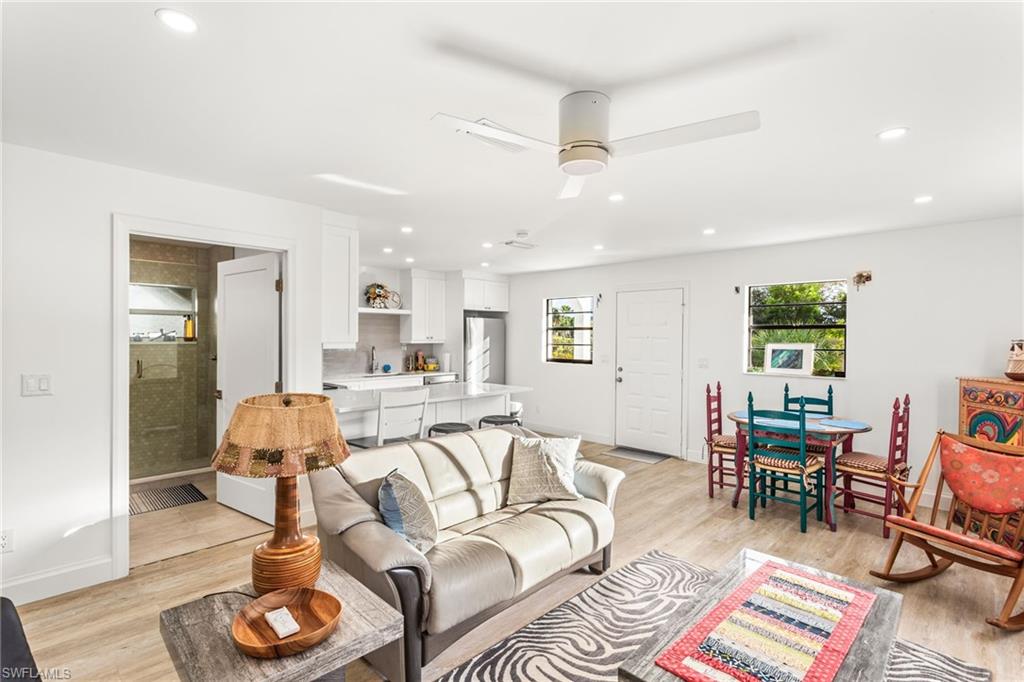 Living area featuring recessed lighting, light wood-type flooring, and a ceiling fan