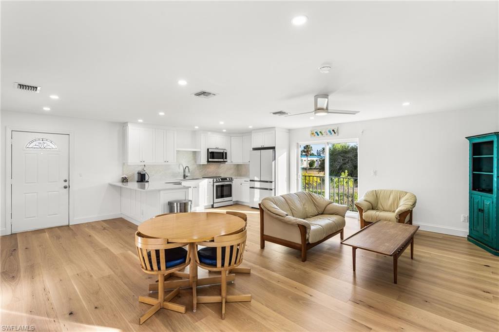 Dining area featuring recessed lighting, a ceiling fan, and light wood floors