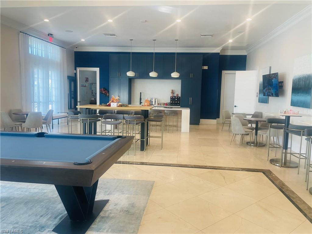 Rec room with billiards, ornamental molding, and recessed lighting