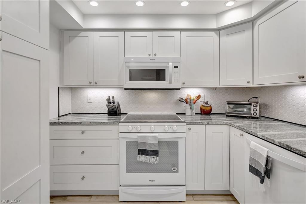 Kitchen featuring newer appliances, lazy susan in corner and recessed lighting