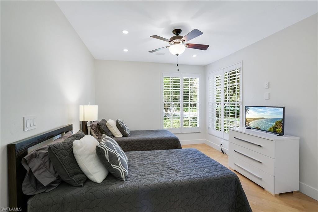 Bedroom featuring light wood finished floors, recessed lighting, and ceiling fan