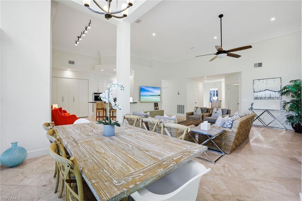Dining room featuring crown molding and ceiling fan