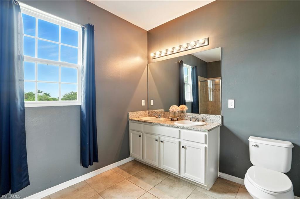 Bedroom featuring wood finished floors and ceiling fan