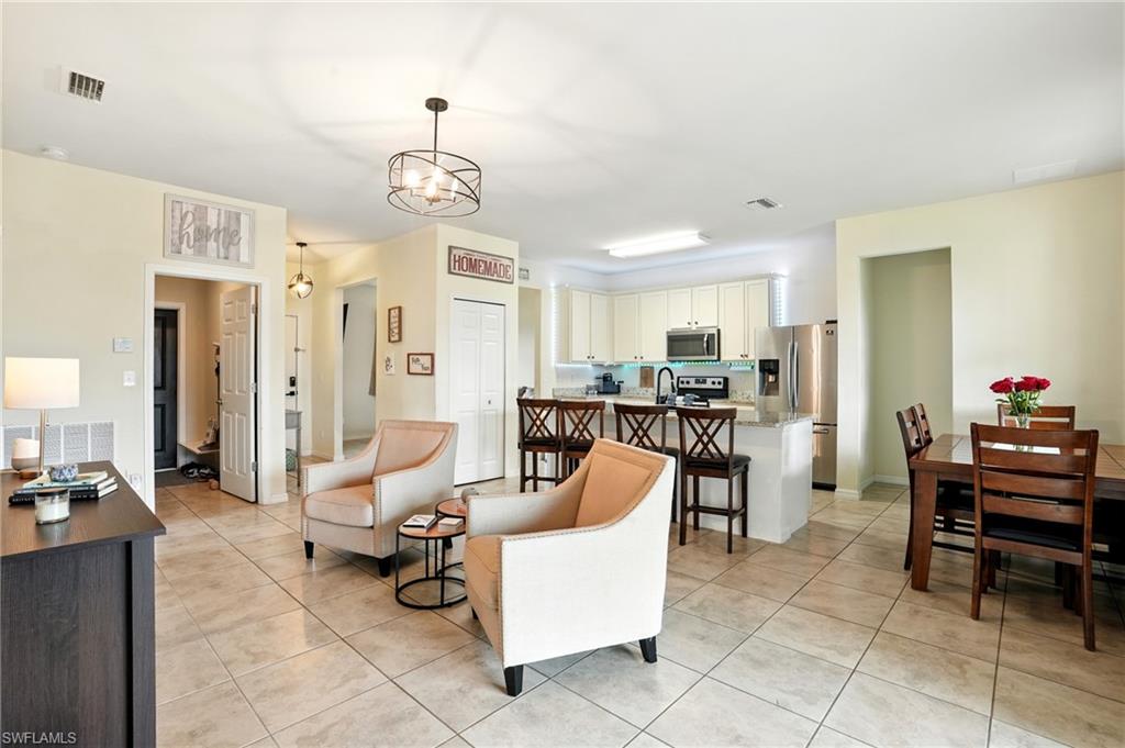 Living area featuring light tile patterned flooring