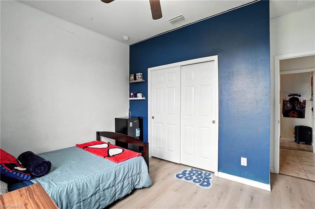 Bedroom with light wood-type flooring and ceiling fan
