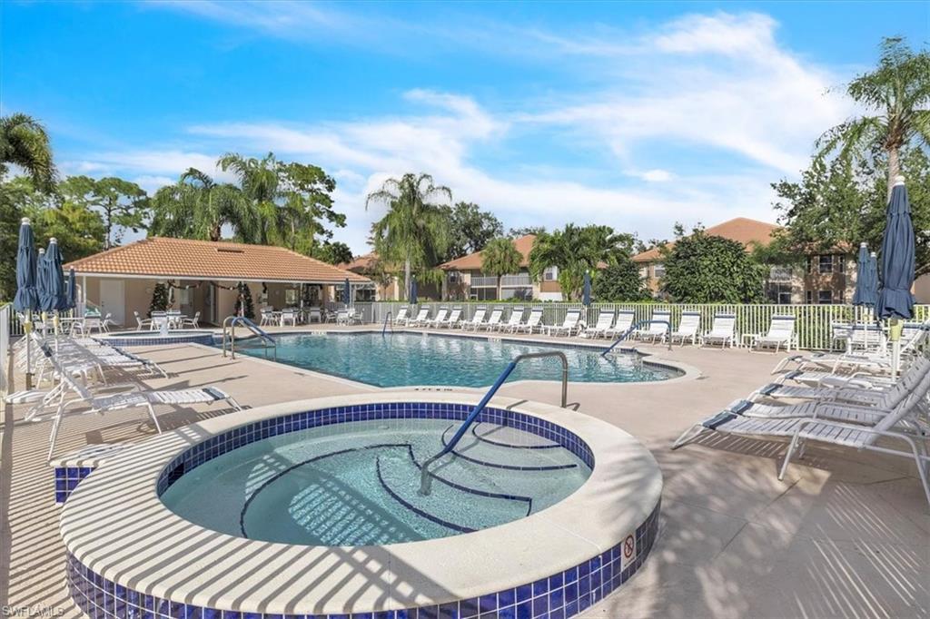Community pool with a community hot tub and a patio