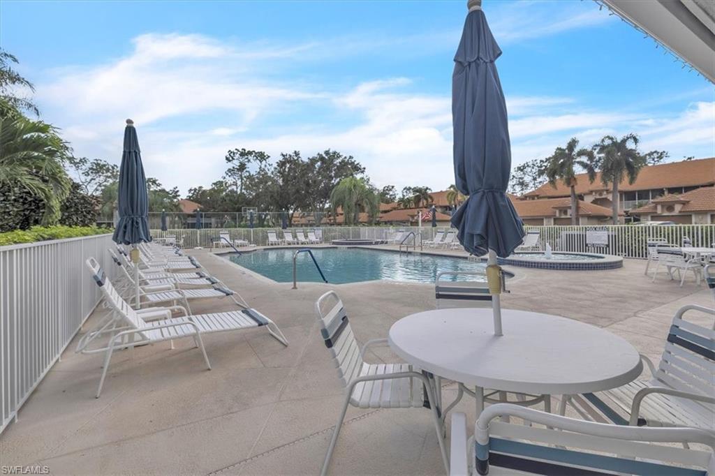 Community pool featuring a patio