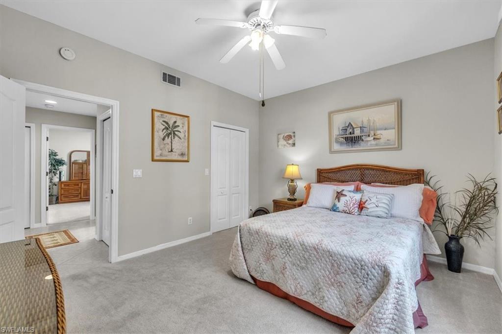 Bedroom featuring carpet floors, a closet, and ceiling fan