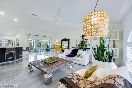 Living room featuring lofted ceiling