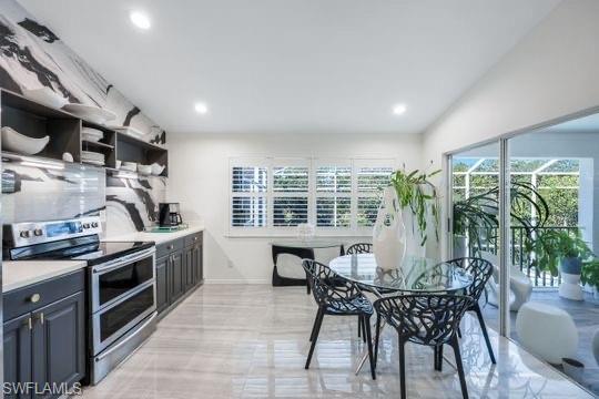 Kitchen with stainless steel range with electric stovetop