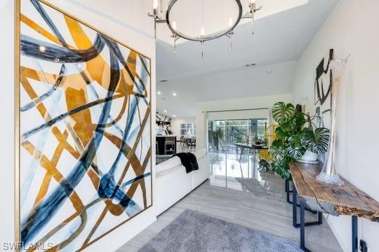 Foyer entrance featuring a notable chandelier