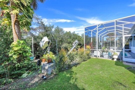 View of yard featuring a lanai
