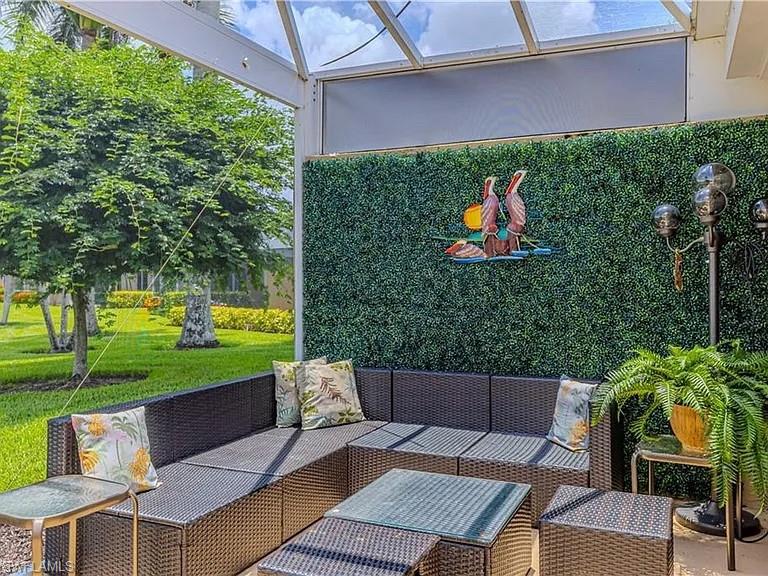 View of patio / terrace featuring an outdoor hangout area and a sunroom