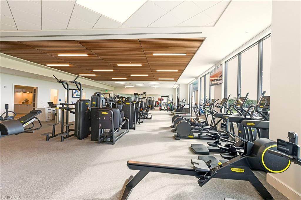 Workout area featuring floor to ceiling windows