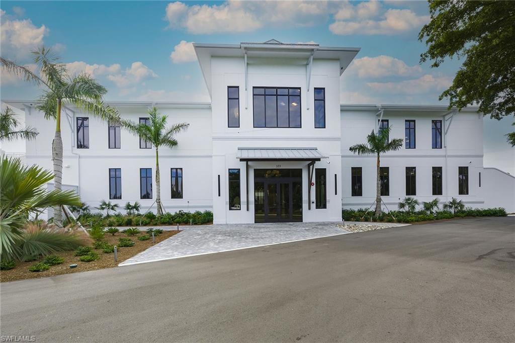 View of front facade featuring french doors and stucco siding