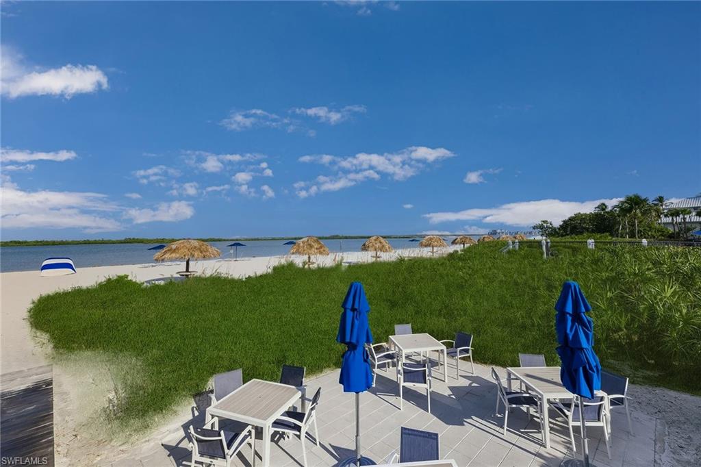 View of patio featuring outdoor dining area and a water view