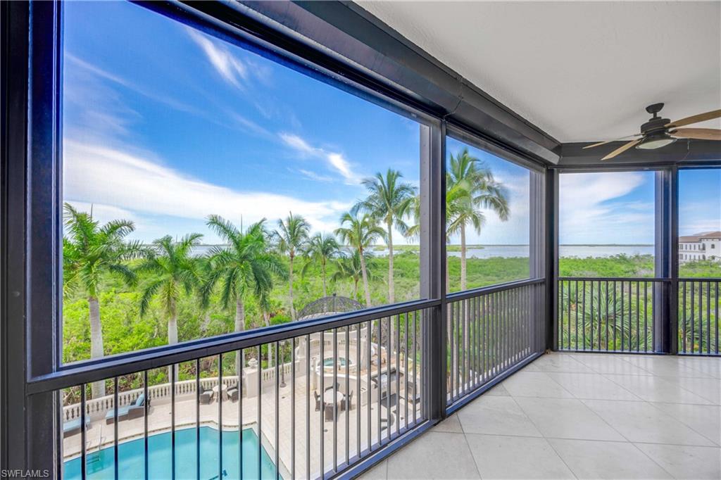 covered screened lanai with electric shutter off the master bedroom
