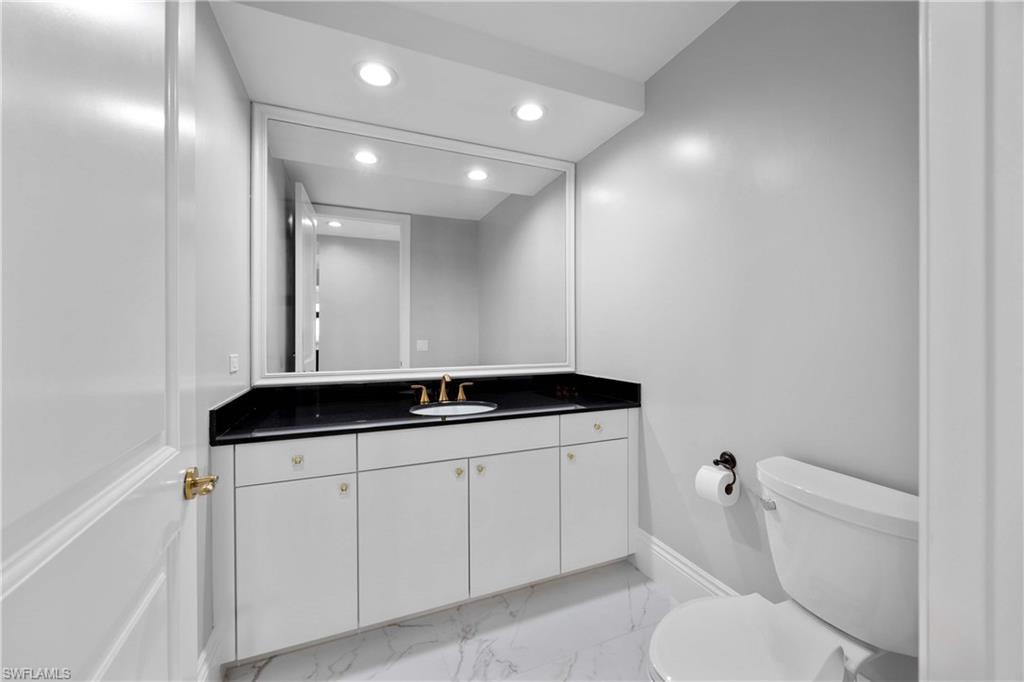 Powder room off the hallway across from kitchen