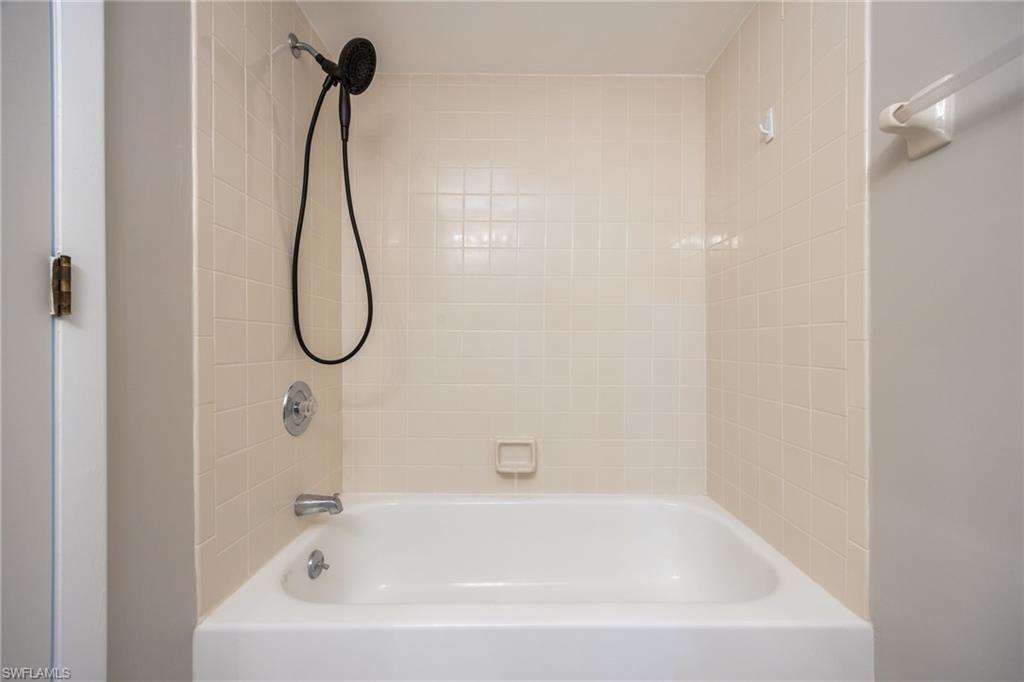 Bathroom with shower / washtub combination