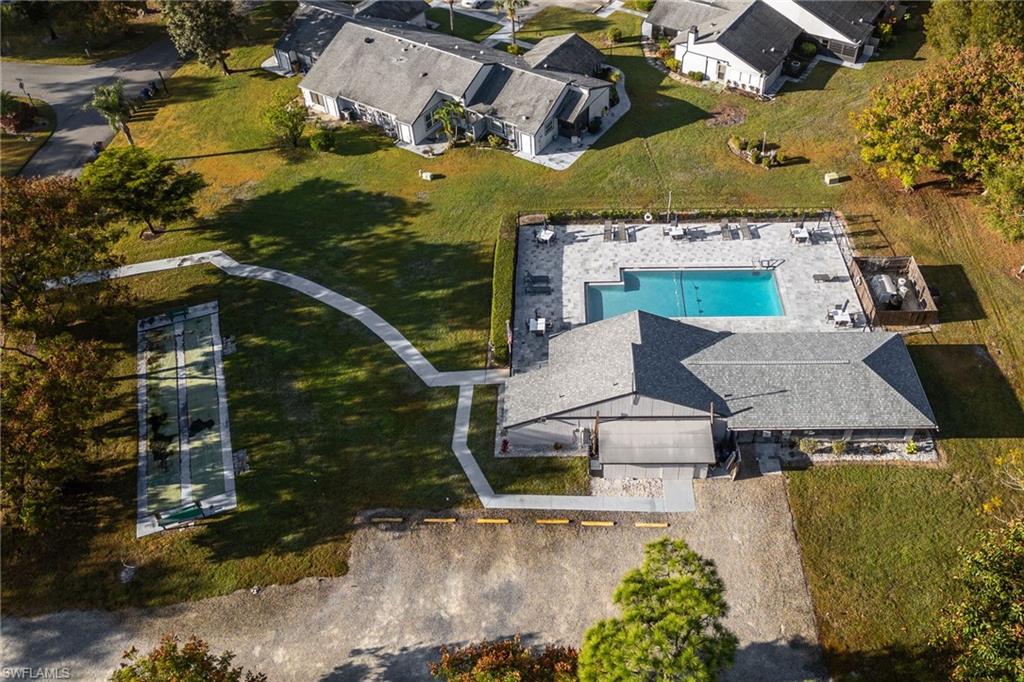 Aerial view of residential area featuring a pool area