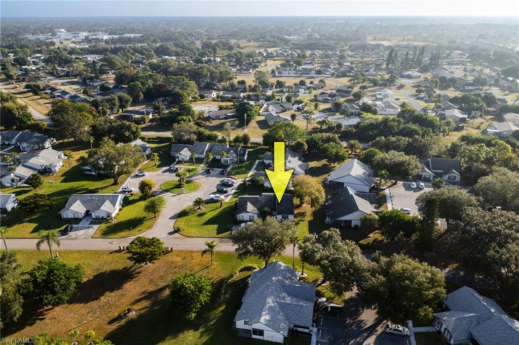 Aerial overview of property's location with nearby suburban area