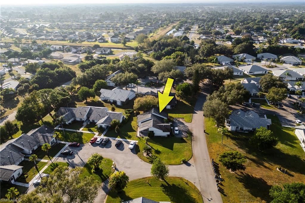Aerial view of property's location featuring nearby suburban area