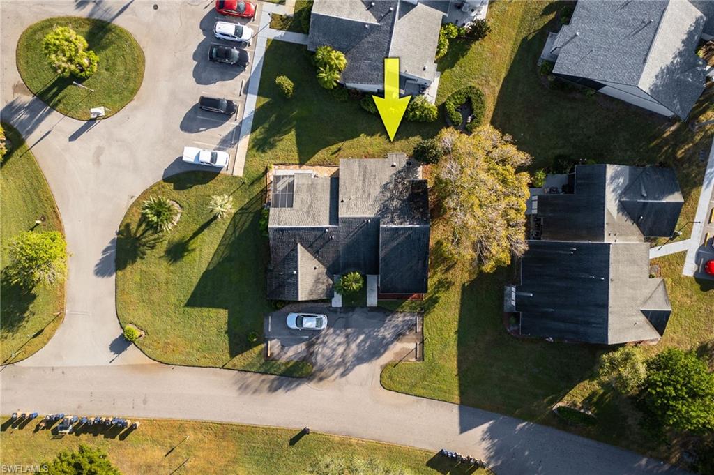 Aerial overview of property's location with nearby suburban area