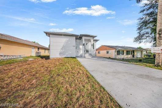 View of front of house featuring stucco siding