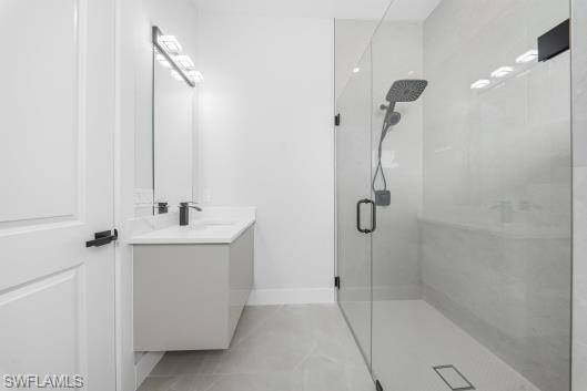 Full bathroom featuring vanity and a marble finish shower