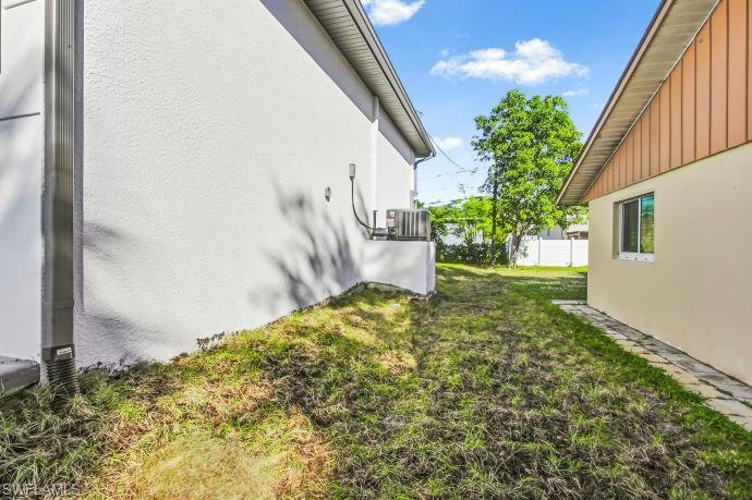View of side of property with stucco siding and board and batten siding