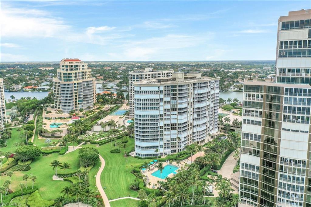 Drone / aerial view with a water view and a city view