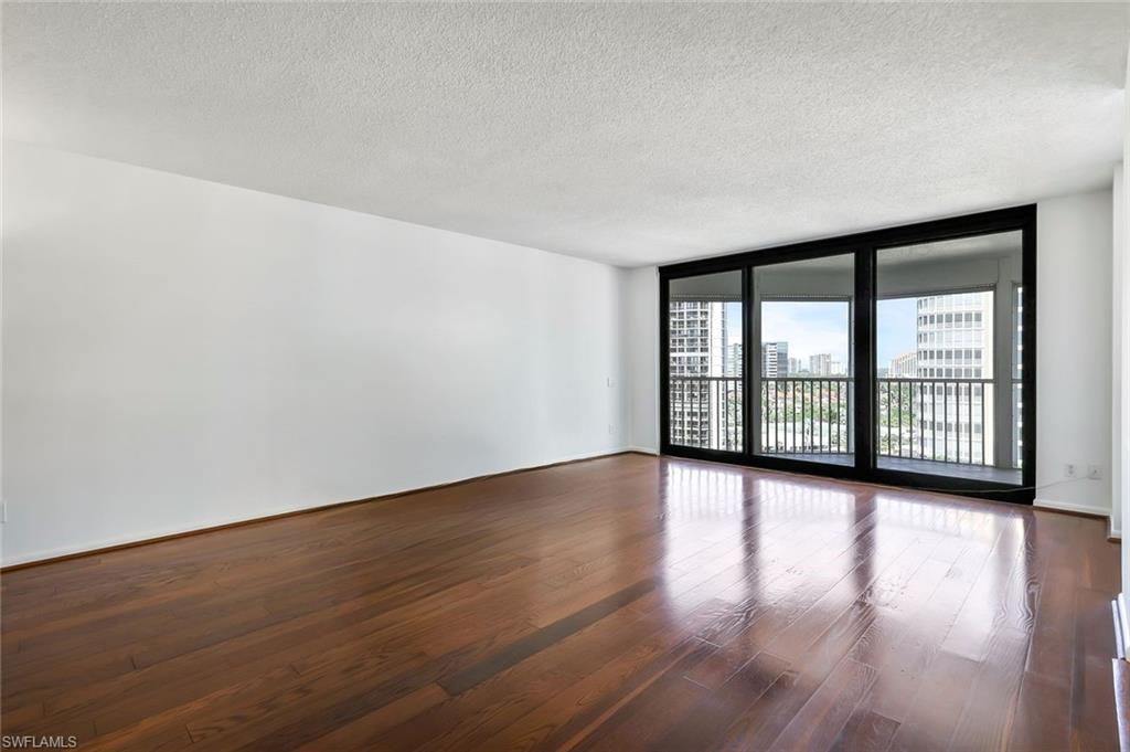 Spacious living room with wood floors.