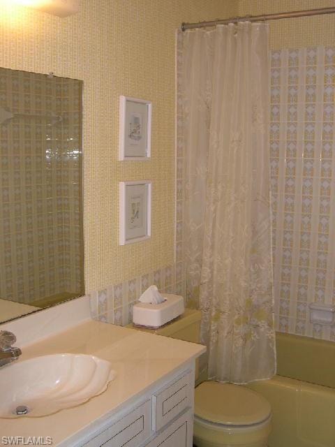 Guest bathroom with tub/shower combo.
