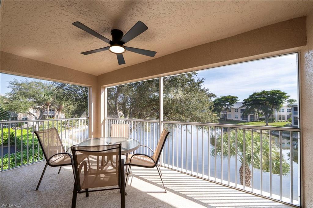 Lanai with lake view and water feature.