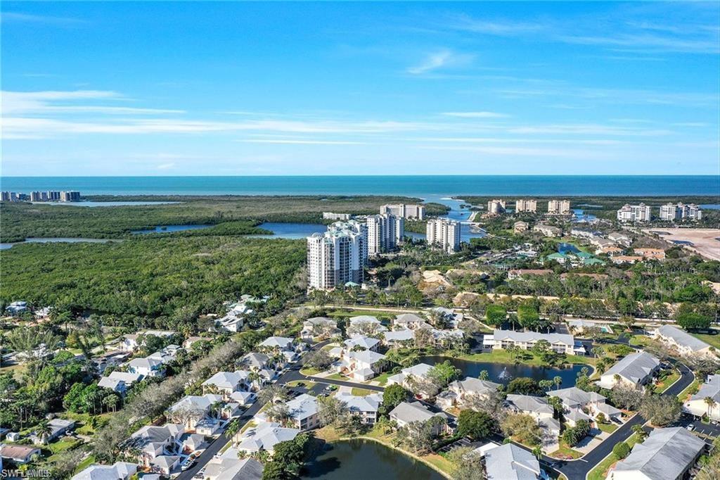 View of community facing West. Pristine beaches close by. Pictured is Wiggins Pass State Park (just a 3 mile ride) to the left with gulf access through Wiggins Pass. Barefoot Beach Preserve to the right pictured.