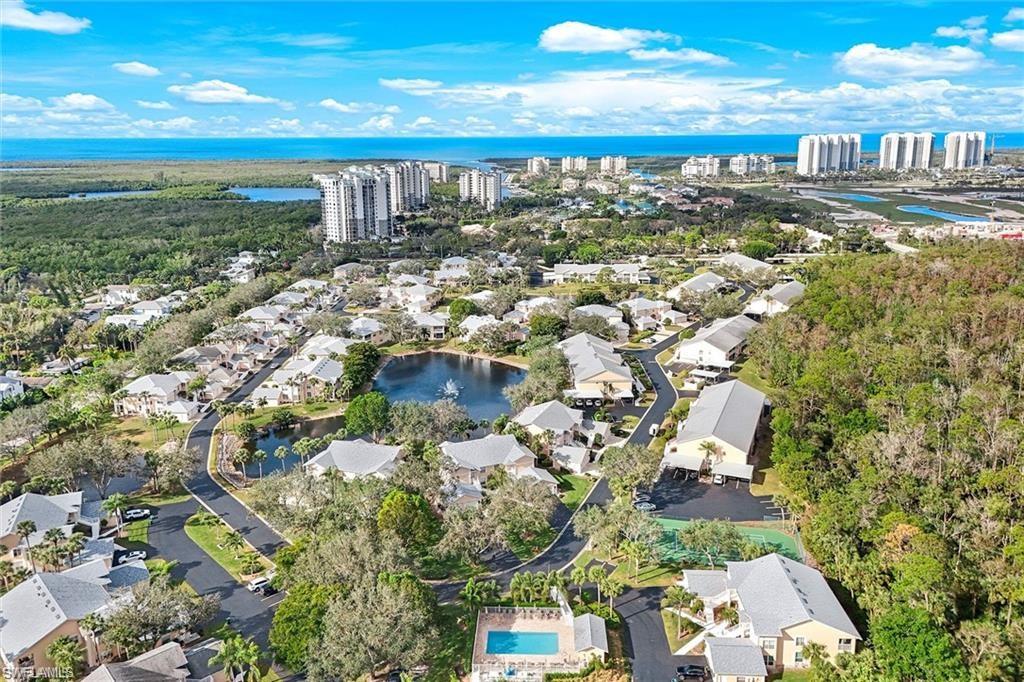 View of community facing West. Pristine beaches close by. Wiggins Pass State Park (just a 3 mile ride) to the left and Barefoot Beach Preserve to the right pictured.