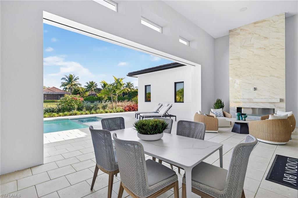 Outdoor dining area features remote screen system