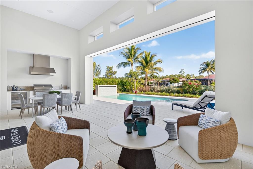 Large outdoor covered lanai and outdoor kitchen area