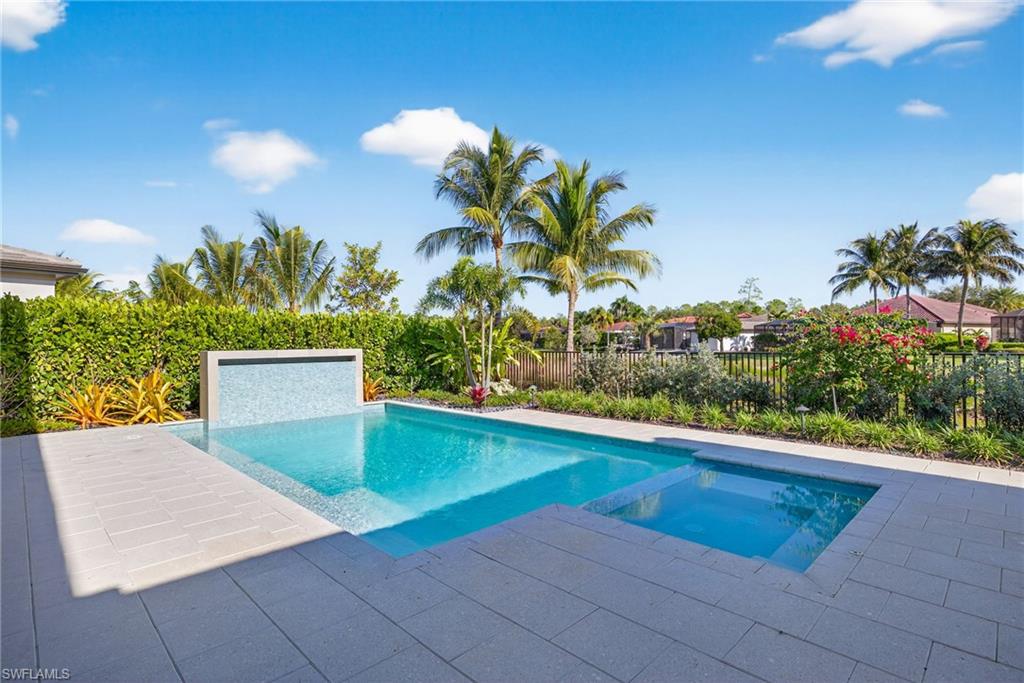 Pool and spa with views of lake