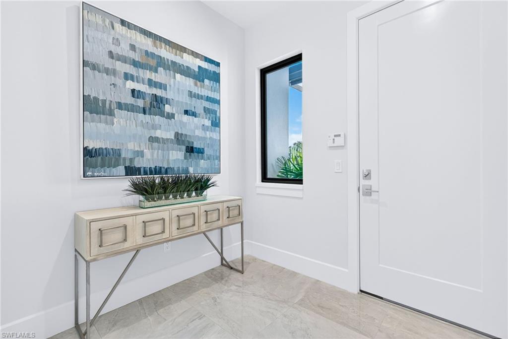 Elegant modern entryway from garage space